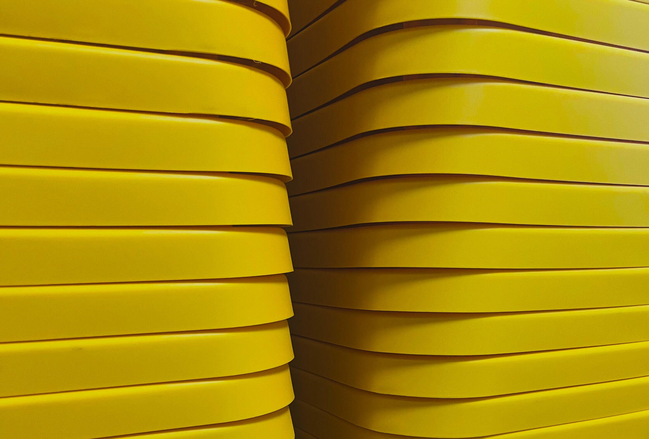 A stack of heavy-duty yellow TurtleTotes moving totes